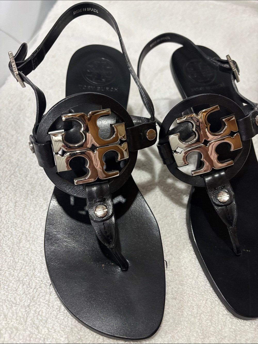 NWOR. Never worn Tory Burch Black Leather Thong Sandals with Gold Logo Medallion